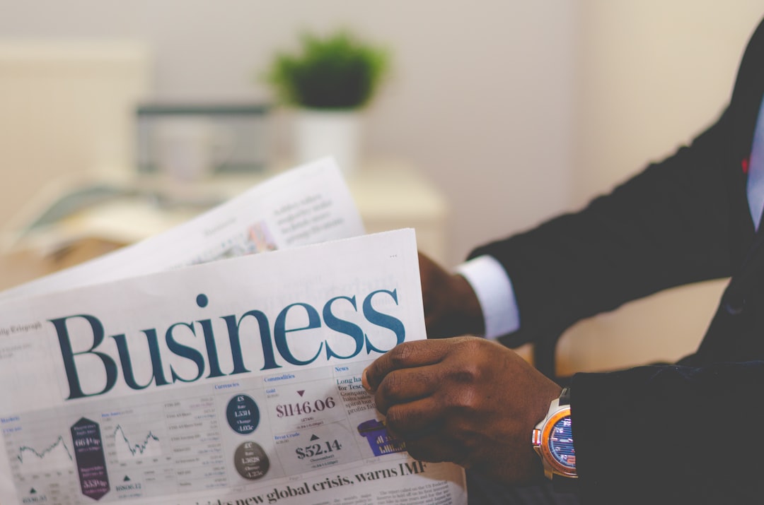 about-us Businessman opening a paper